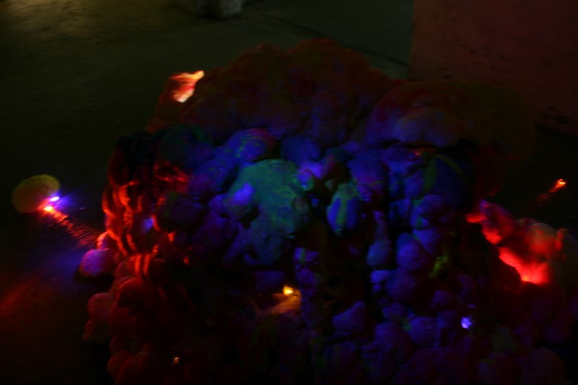 Title: 'Chit Chat Tummy [Installation View 2 (Rear)]' by Blake Peterson (2012) Media: Video, latex, acrylic, metallic ink, ink wash, screen-printing ink, and LED lights. Dimensions: 7 ft tall x 9 ft wide